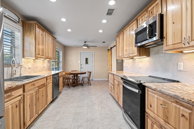 314 Cedar, Mount Pleasant, TX 75455 - kitchen with recessed lighting, visible vents, black range with electric stovetop, a sink, and stainless steel microwave