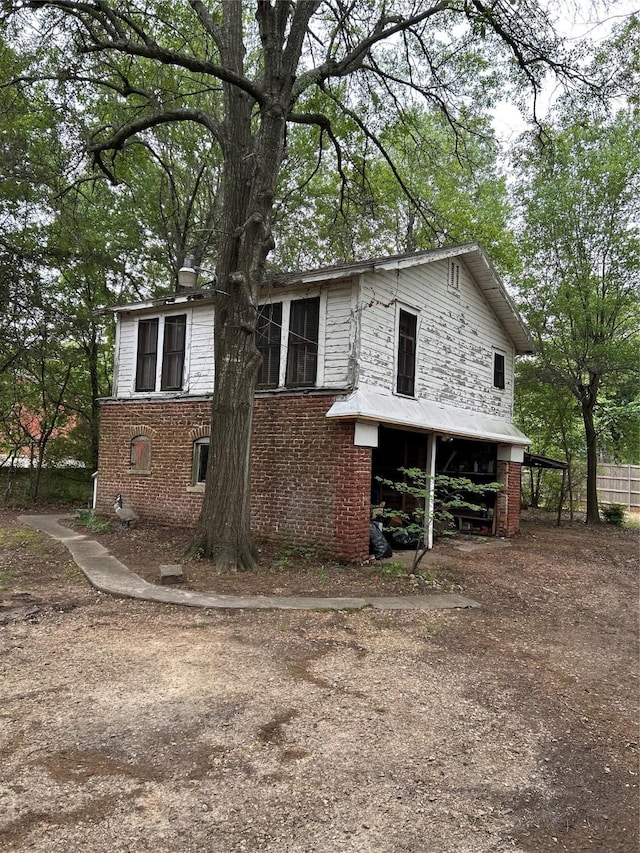 view of front of home featuring brick siding