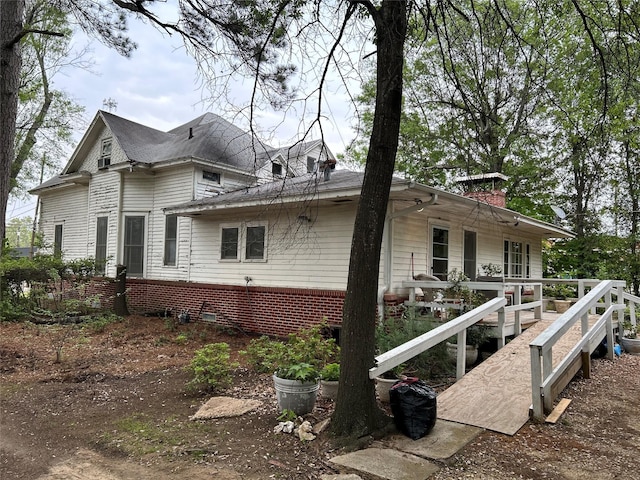 view of home's exterior featuring a chimney