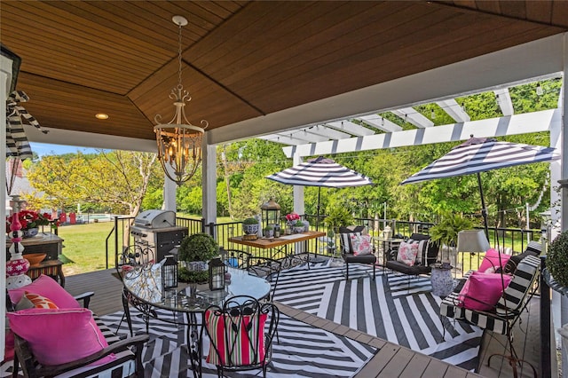 wooden deck featuring grilling area, a pergola, and outdoor dining space
