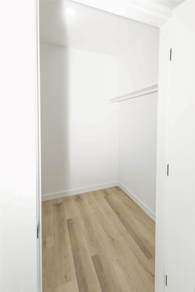walk in closet featuring light wood-type flooring