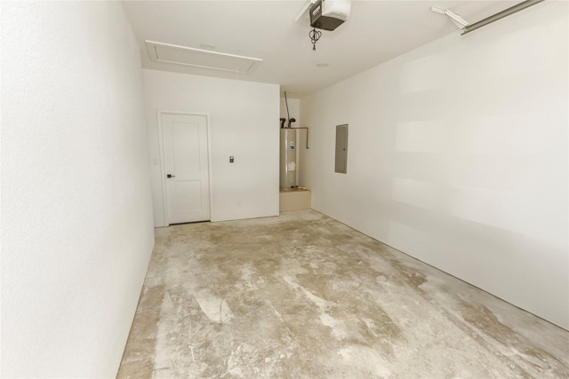 garage featuring water heater, a garage door opener, and electric panel