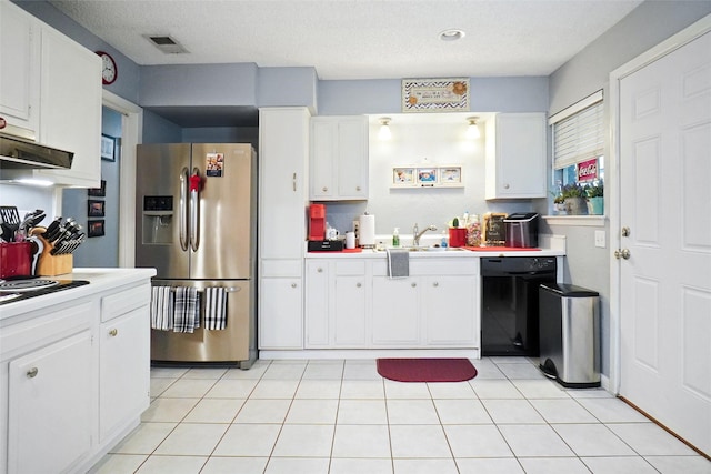kitchen featuring light countertops, black appliances, and a sink