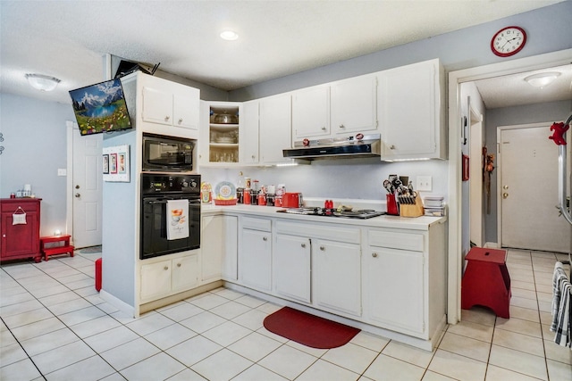 kitchen with light countertops, light tile patterned floors, black appliances, and under cabinet range hood