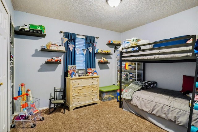 bedroom featuring carpet and a textured ceiling