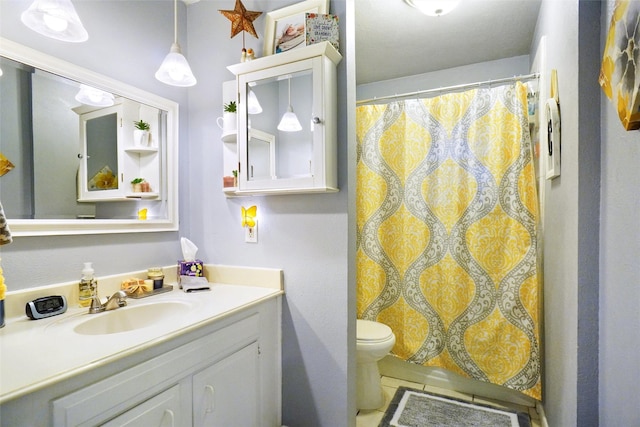 bathroom with vanity, toilet, and a shower with shower curtain