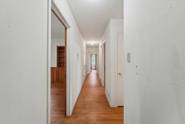 corridor with light wood-type flooring