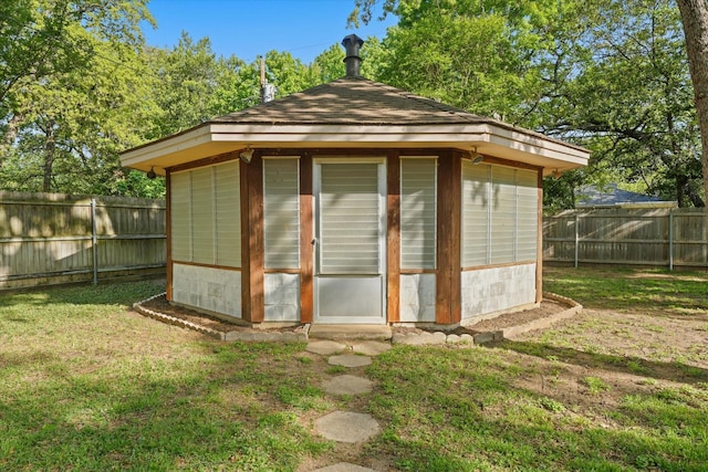 view of shed featuring a fenced backyard