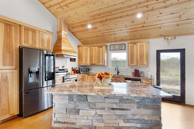 kitchen with light stone counters, a center island, light brown cabinetry, stainless steel appliances, and wooden ceiling