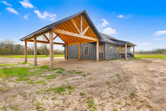 view of outbuilding featuring a carport and driveway