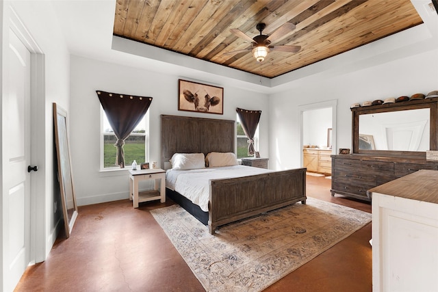 bedroom featuring a tray ceiling, baseboards, and wooden ceiling