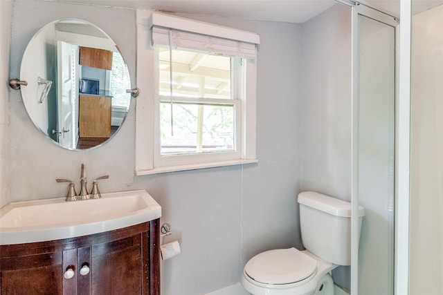 bathroom featuring toilet and vanity