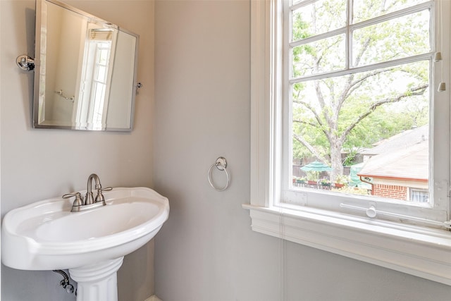 bathroom featuring a healthy amount of sunlight and a sink