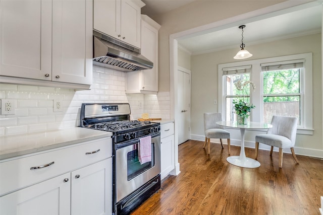 kitchen with stainless steel range with gas cooktop, light countertops, under cabinet range hood, and tasteful backsplash