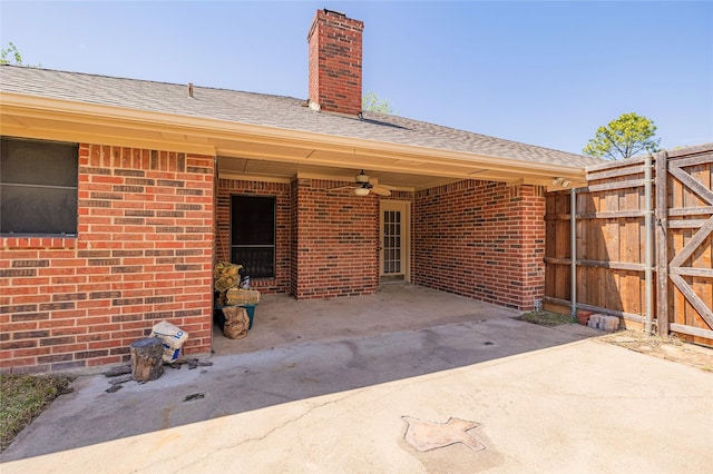 view of patio / terrace featuring fence and ceiling fan