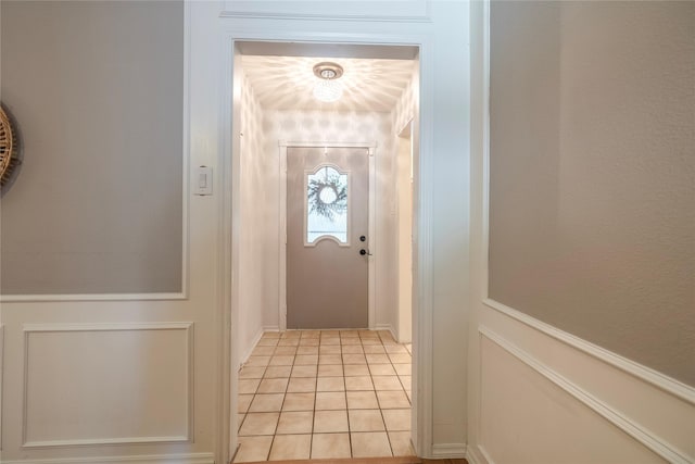 doorway to outside featuring light tile patterned floors