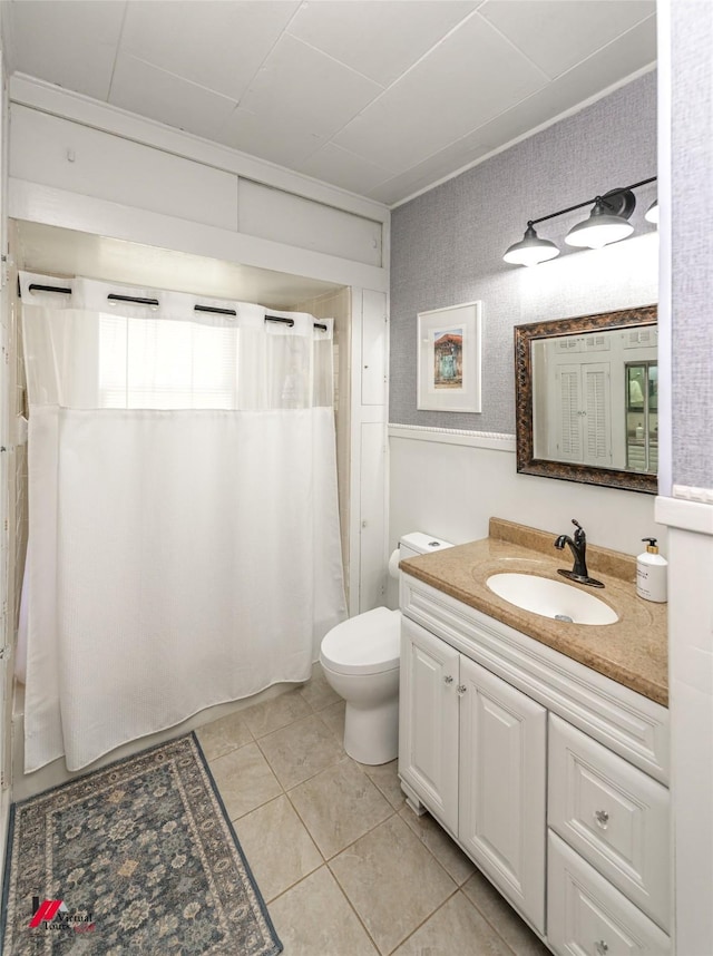 full bathroom featuring shower / bath combo, tile patterned floors, vanity, and toilet