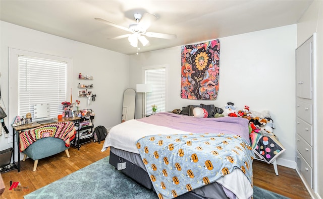 bedroom featuring a ceiling fan and wood finished floors