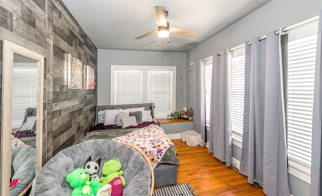 bedroom with wood finished floors and a ceiling fan