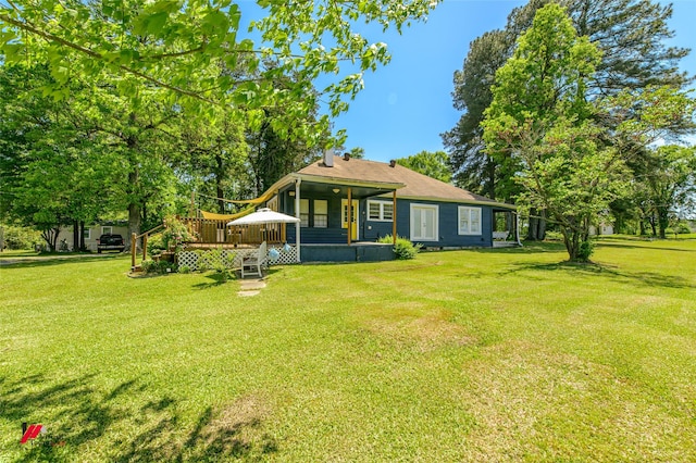 exterior space with a lawn and a deck