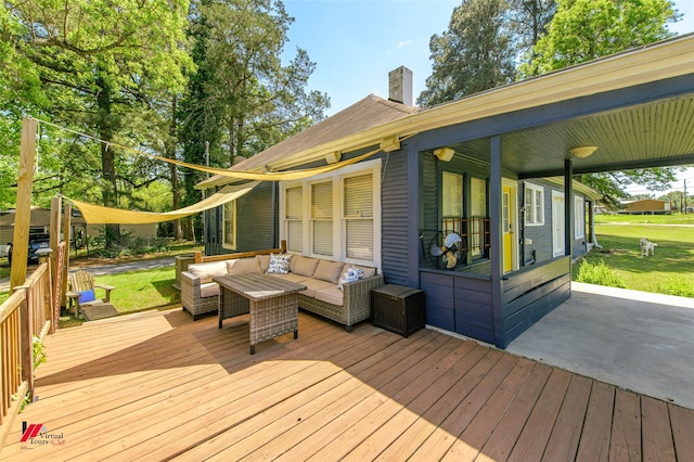 wooden terrace with a yard and outdoor lounge area