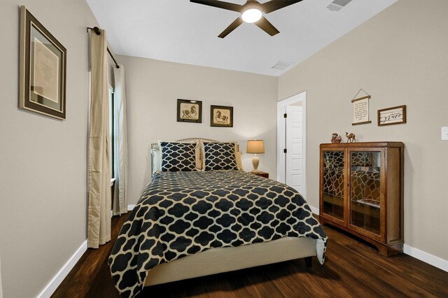 bedroom with baseboards, dark wood-style floors, and ceiling fan