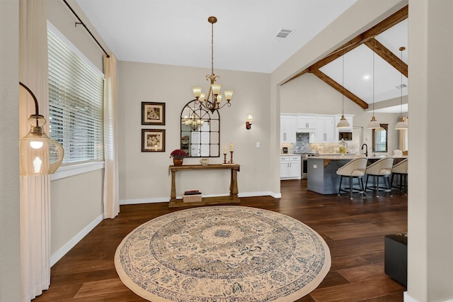 dining area featuring vaulted ceiling with beams, visible vents, a notable chandelier, and dark wood finished floors