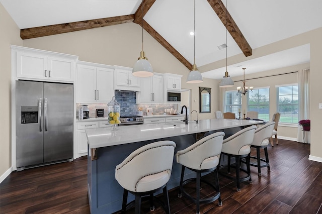 kitchen featuring dark wood-style floors, visible vents, decorative backsplash, appliances with stainless steel finishes, and white cabinetry