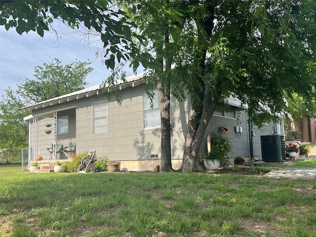 108 E Neely Ave, Comanche, TX 76442 - view of home's exterior with a yard, central AC unit, and fence