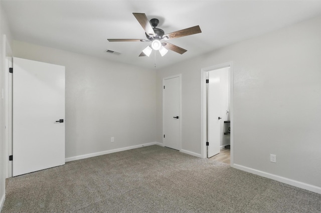 unfurnished bedroom featuring visible vents, carpet flooring, baseboards, and a ceiling fan
