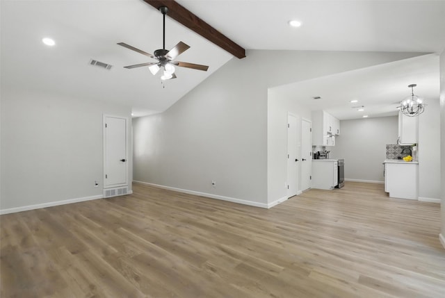unfurnished living room featuring ceiling fan with notable chandelier, vaulted ceiling with beams, light wood-style flooring, visible vents, and recessed lighting