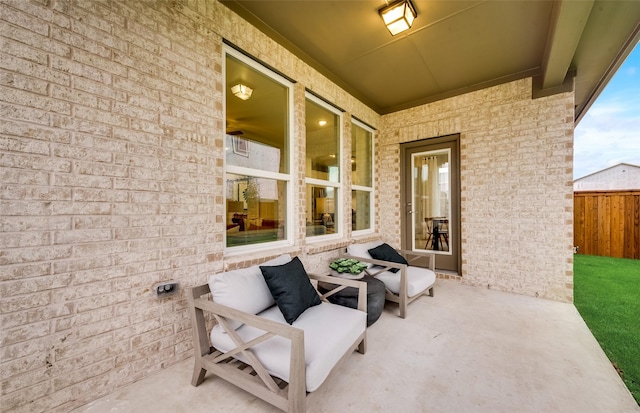 view of patio / terrace featuring fence