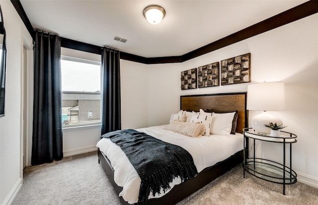 bedroom with baseboards, carpet flooring, and visible vents
