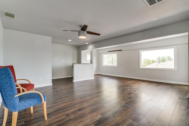 unfurnished living room with baseboards, french doors, visible vents, and wood finished floors