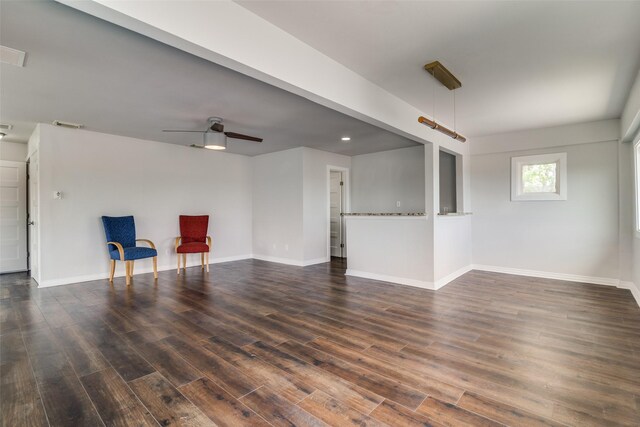 sitting room featuring baseboards, dark wood finished floors, ceiling fan, and visible vents