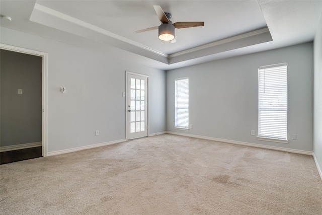 unfurnished bedroom featuring a ceiling fan, visible vents, a wainscoted wall, wallpapered walls, and dark wood-type flooring
