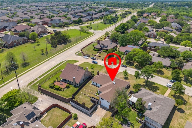 birds eye view of property with a residential view