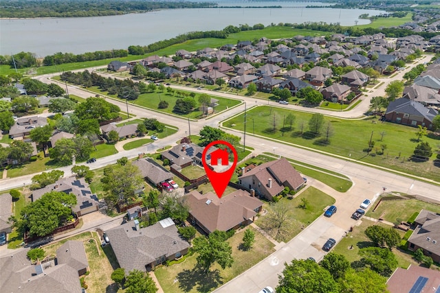 birds eye view of property featuring a residential view and a water view