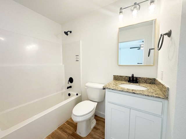 2408 Miller St, Denison, TX 75020 - full bath with toilet, baseboards, shower / bath combination, wood finished floors, and vanity