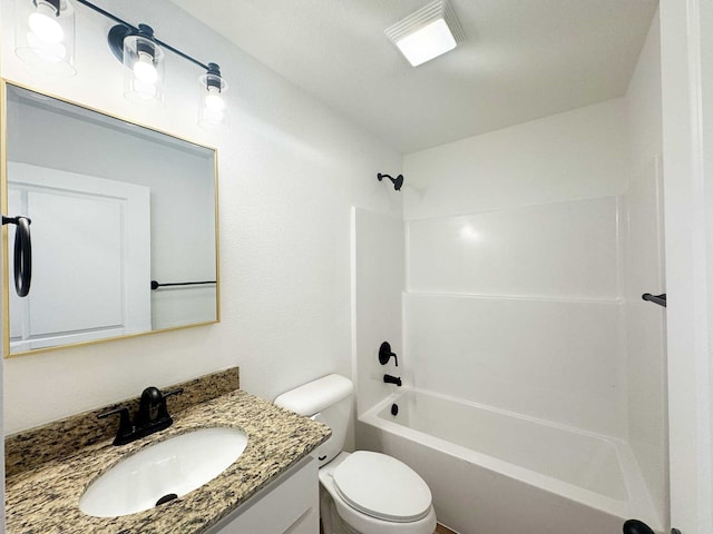 2408 Miller St, Denison, TX 75020 - bathroom with vanity, tub / shower combination, and toilet