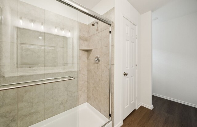 7108 Pederson Creek Way, Denton, TX 76208 - full bathroom with wood finished floors, a stall shower, and baseboards