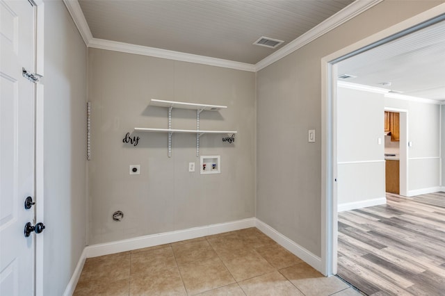 washroom featuring visible vents, crown molding, hookup for an electric dryer, and laundry area