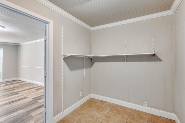 walk in closet with tile patterned floors