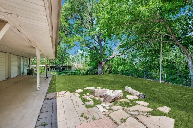 view of yard with a patio and fence