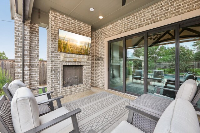 wooden deck with grilling area, a fenced backyard, an outdoor kitchen, a fenced in pool, and an in ground hot tub