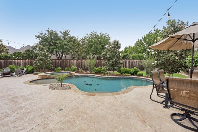 view of patio / terrace featuring fence and an outdoor brick fireplace