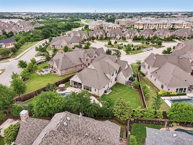 birds eye view of property with a residential view