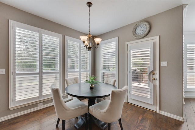 113 Bob White Ct, Rockwall, TX 75087 - dining space with a chandelier, a healthy amount of sunlight, and dark wood-type flooring