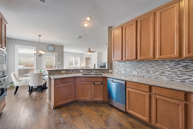 113 Bob White Ct, Rockwall, TX 75087 - kitchen featuring dark wood finished floors, backsplash, stainless steel appliances, and a sink