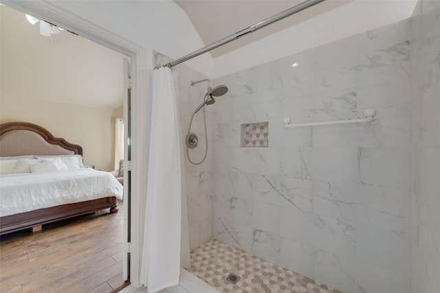 113 Bob White Ct, Rockwall, TX 75087 - ensuite bathroom with wood finished floors, ensuite bath, and a stall shower